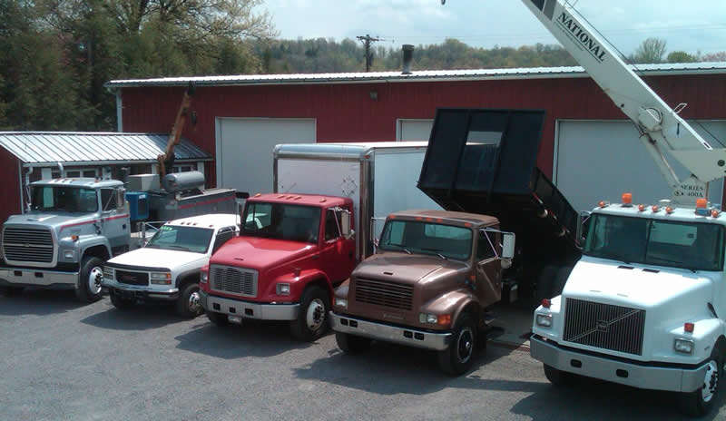 Picture of trucks in front of the shop